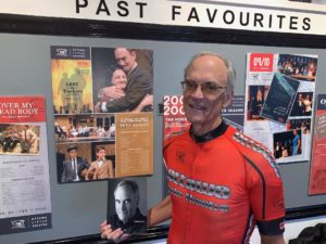 Pictured here is Bob Hicks in his Ottawa Little Theatre cycling Jersey standing in front of his 2011-2012 Lost in Yonkers poster board.